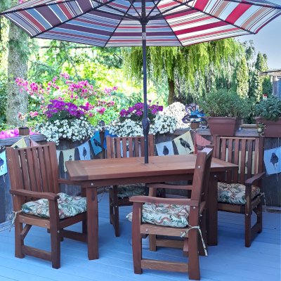 San Francisco Redwood Patio Table (Options: 5' L, 34 1/2" W Tabletop, Chairs, California Redwood, 4 Chairs, Ruth Chair Design, All Arm Chairs, Custom Cushions, Old Country Tabletop, Standard, Slightly Rounded Corners, 1 5/8" Umbrella Hole, Transparent Premium Sealant). Photo Courtesy of E. Salscheider of Tacoma, Washington.
