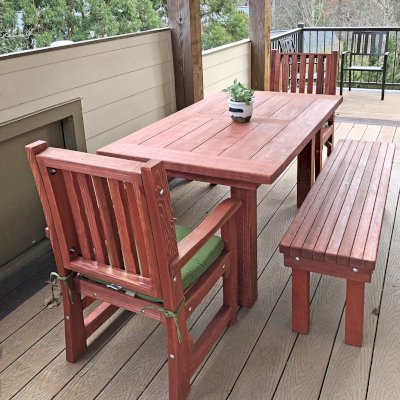 San Francisco Redwood Patio Table (Options: 5' L, 36" W Tabletop, Benches & End Armchairs , California Redwood, Ruth Chairs, No Cushions, Patio Benches, 1 Full Length Benches Per Side, Old Country Tabletop, Standard, Slightly Rounded Corners, No Umbrella Hole,  Cherry Stain Premium Sealant). Photo Courtesy of J. Jimene of Smyrna, Georgia.