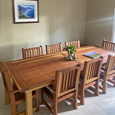 San Francisco Redwood Patio Table (Options: 10' L, 46" W Tabletop, Chairs, California Redwood, 8 Chairs, Ruth Chair Design, All Side Chairs, No Cushions, Old Country Tabletop, Standard, Slightly Rounded Corners, No Umbrella Hole, Transparent Premium Sealant). Photo Courtesy of J. Russo of Monterey, CA.