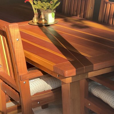 San Francisco Redwood Patio Table (Options: 10' L, 46" W Tabletop, Chairs, California Redwood, 8 Chairs, Ruth Chair Design, All Side Chairs, No Cushions, Old Country Tabletop, Standard, Slightly Rounded Corners, No Umbrella Hole, Transparent Premium Sealant). Photo Courtesy of J. Russo of Monterey, CA.