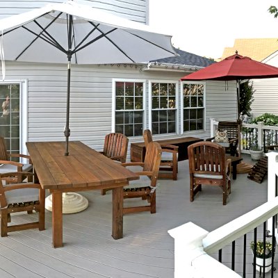 San Francisco Redwood Patio Table (Options: 8' L, 40 1/4" W Tabletop, Chairs, Mature Redwood, 6 Chairs, Luna Chair Design, All Armchairs, Custom Color Cushions, Standard Tabletop, Rounded Corners, 2" Umbrella Hole, Transparent Premium Sealant). Furniture was 2 years old when the photo was taken. Photo Courtesy of Martin Holbrook of Forest Hill, Maryland.