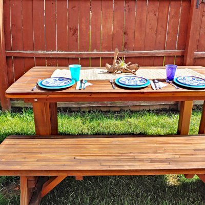 San Francisco Redwood Patio Table (Options: 6' L, 34 1/2" W Tabletop, Classic Picnic Benches, Mosaic Redwood, 1 Full Length Bench Per Side, Bench Seats 17" Wide Instead of 11 1/2" Wide per Custom Request, No Cushions, Standard Tabletop, Squared Corners, No Umbrella Hole, Transparent Premium Sealant). Photo Taken 3 Years After Installation. Photo Courtesy of P. Oberhaus of Alliance, Ohio.