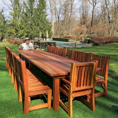 San Francisco Redwood Patio Table (Options: 14' L, 48" W Tabletop, Chairs, California Redwood, 14 Chairs, Ruth Chair Design, 2 Armchairs + Side Chairs, No Cushions, Custom Tabletop - Book Ended Boards to Create Illusion That it is Only 4 Boards, Each 11 1/2" Wide, Rounded Corners, No Umbrella Hole, Transparent Premium Sealant). Photo Courtesy of P. Scaturro of Bedford, New York.