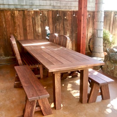 San Francisco Redwood Patio Table (Options: 8' L, 34 1/2" W Tabletop, Chairs, California Redwood, Benches & Chairs, Luna Chair Design, Two 4' benches, 4 Luna Dining Chairs and One Armchair, No Cushions, Old Country Tabletop, Standard, Squared Corners, No Umbrella Hole, Coffee-Stain Premium Sealant). Photo Courtesy of S. Perreira of Hollister, California.