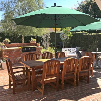 San Francisco Redwood Patio Table (Options: 8' L, 40 1/4" W Tabletop, Chairs, California Redwood, 8 Chairs, Luna Chair Design, 2 Armchairs & Side Chairs, No Cushions, Old Country Tabletop, Seamless, Slightly Rounded Corners, 1 5/8" Umbrella Hole, Transparent Premium Sealant). Photo Courtesy of N. Kepner of Whittier, CA.