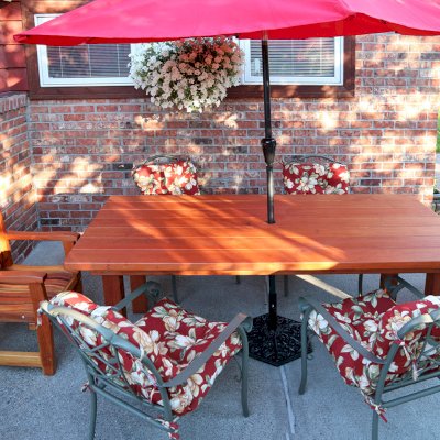 San Francisco Redwood Patio Table (Options: 7' L, 40 1/4" W Tabletop, Chairs, California Redwood, 2 Chairs, Ruth Chair Design, All Armchairs, No Cushions, Standard Tabletop, Slightly Rounded Corners, 1 5/8" Umbrella Hole, Transparent Premium Sealant). Photo Courtesy of W. Morlin of Spokane, Washington.