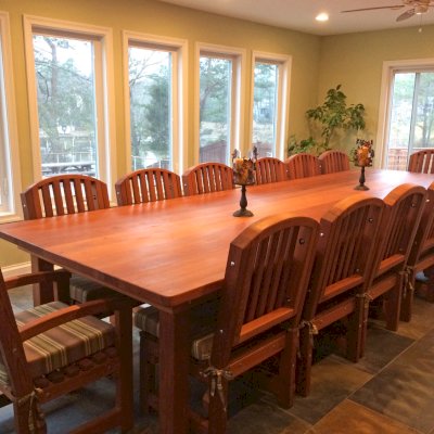 San Francisco Redwood Patio Table (Options: 14' L, 57 1/2" W Tabletop, Chairs, Old-Growth Redwood, 14 Chairs, Luna Chair Design, 2 Armchairs & Side Chairs, Custom Cushions, Seamless Tabletop, Rounded Corners, No Umbrella Hole, Transparent Premium Sealant). Photo Courtesy of Cherrie Hansen