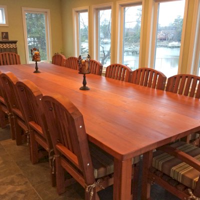San Francisco Redwood Patio Table (Options: 14' L, 57 1/2" W Tabletop, Chairs, Old-Growth Redwood, 14 Chairs, Luna Chair Design, 2 Armchairs & Side Chairs, Custom Cushions, Seamless Tabletop, Rounded Corners, No Umbrella Hole, Transparent Premium Sealant). Photo Courtesy of Cherrie Hansen
