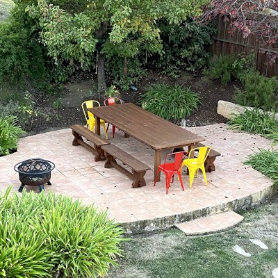 San Francisco Redwood Patio Table (Options: 10' L, 48" W Tabletop, California Redwood, Side Benches, 2 Half Length Benches Per Side, Trestle Bench Style, Old Country Tabletop, Standard, Slightly Rounded Corners, 2" Umbrella Hole, Coffee-Stain Premium Sealant). Photo Courtesy of L. White of Castro Valley, CA.