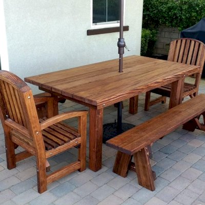 San Francisco Redwood Patio Table (Options: 6' L, 40 1/4" W Tabletop, Douglas-fir, Side Benches & End Chairs, Luna Chairs, Classic Picnic Benches, Standard Tabletop, Square Corners, 1 5/8" Umbrella Hole, Coffee Stain Premium Sealant). Photo Courtesy of H. M. Via of Valencia, CA. Douglas-Fir when stained dark creates a "tiger stripe" effect as shown in this photo. It is beautiful and most customers love it. If you are looking for a dark consistent stain, please go with Mature Redwood for the most consistent staining result.