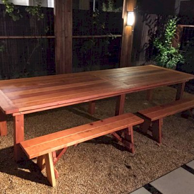 San Francisco Redwood Patio Table (Options: 12' L, 46" W Tabletop, Side Benches, California Redwood, Classic Picnic Benches, 2 Half Leggth Benches Per Side, Old-Country Tabletop - Standard, Rounded Corners, No Umbrella Hole, Transparent Premium Sealant). Photo Courtesy of Steve Carlson of Playa del Rey, CA.
