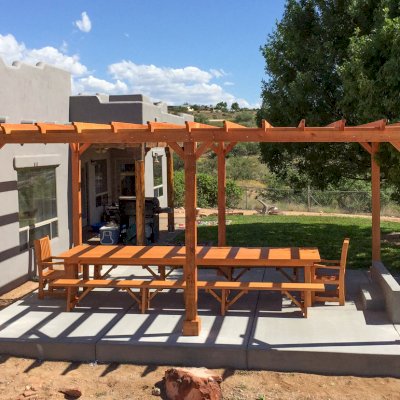 San Francisco Redwood Patio Table under a Garden Pergola (Options: 14'L, 46" W Tabletop, Benches & End Armchairs, Douglas-fir, Ruth, No Cushion, Classic Picnic Benches, 1 Full Length Bench Per Side, Standard Tabletop, Squared Corners, No Umbrella Hole, Transparent Premium Sealant). Photo Courtesy of Chris D. of Cornville Arizona.
