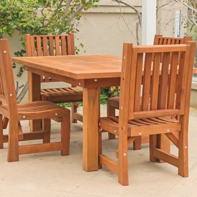 San Francisco Redwood Patio Table (Options: 6' L, 40 1/4" W Tabletop, Chairs, Mature Redwood, 4 Chairs, Ruth Chair Design, All Side Chairs, No Cushions, Old Country Tabletop, Standard, Squared Corners, No Umbrella Hole, Transparent Premium Sealant). Table Set Under a Traditional Garden Pergola in White Finish. Photo Courtesy of J. Schulte of Laguna Niguel, CA.