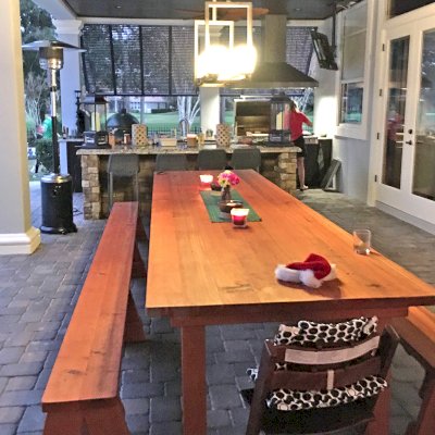 San Francisco Redwood Patio Table (Options: 14' L, 46" W Tabletop, Old-Growth Redwood, Side Benches, Classic Picnic Benches, Seamless Tabletop, Slightly Rounded Corners, No Umbrella Hole, Transparent Premium Sealant). Photo Courtesy of M. Pat Burke of Longwood, FL.