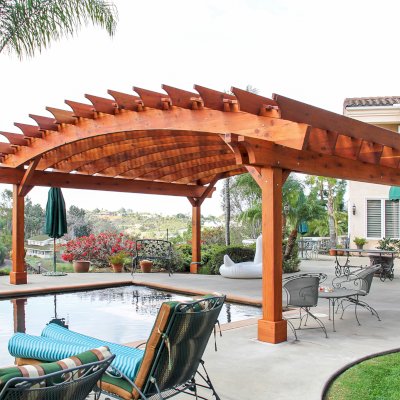 Sebastopol Pergolas (Options: 26' L x 24' Arc W, Mature Redwood, 4-Post Anchor Kit for High-Wind, Transparent Premium Sealant). Photo Courtesy of Ms. Diane Williams of Encinitas, CA. Photo shows extra large timber custom design with 8x8 posts and 2x10 arches, 26 ft long.