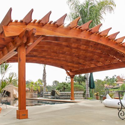 Sebastopol Pergolas (Options: 26' L x 24' Arc W, Mature Redwood, 4-Post Anchor Kit for High-Wind, Transparent Premium Sealant). Photo Courtesy of Ms. Diane Williams of Encinitas, CA. Photo shows extra large timber custom design with 8x8 posts and 2x10 arches, 26 ft long.