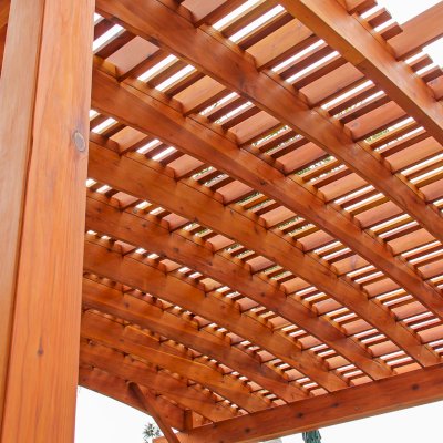Sebastopol Pergolas (Options: 26' L x 24' Arc W, Mature Redwood, 4-Post Anchor Kit for High-Wind, Transparent Premium Sealant). Photo Courtesy of Ms. Diane Williams of Encinitas, CA. Photo shows extra large timber custom design with 8x8 posts and 2x10 arches, 26 ft long.