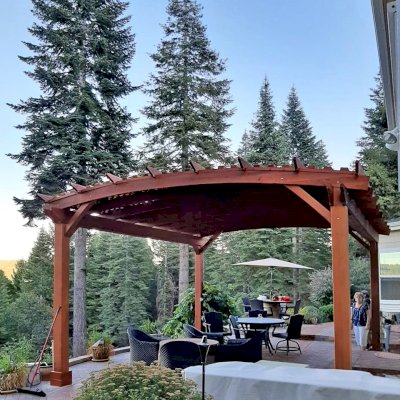 Custom Sebastopol Pergolas (Options: 20' L x 18' Arc W, California Redwood, 4-Post Anchor Kit for Concrete, with Lattice Panels by Custom Request, No Ceiling Fan Base, 10' H Posts, Transparent Premium Sealant). Photo Courtesy of E. Greenwood of Nevada City, California.