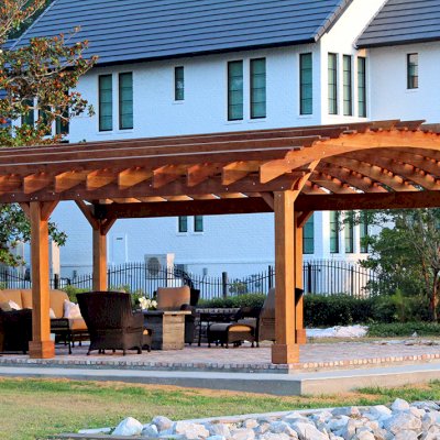Sebastopol Pergolas (Options: 32' L x 24' Arc W, California Redwood, 6-Post Anchor Kit for High-Wind, No Ceiling Fan Base, Transparent Premium Sealant). Photo Courtesy of J. Graves of Santa Rosa Beach, Florida.