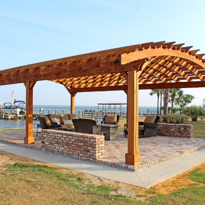 Sebastopol Pergolas (Options: 32' L x 24' Arc W, California Redwood, 6-Post Anchor Kit for High-Wind, No Ceiling Fan Base, Transparent Premium Sealant). Photo Courtesy of J. Graves of Santa Rosa Beach, Florida.