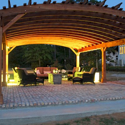 Sebastopol Pergolas (Options: 32' L x 24' Arc W, California Redwood, 6-Post Anchor Kit for High-Wind, No Ceiling Fan Base, Transparent Premium Sealant). Photo Courtesy of J. Graves of Santa Rosa Beach, Florida.