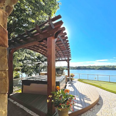 Custom Sebastopol Pergola (Options: 22' L x 12' Arc W, California Redwood, 4-Post Anchor Kit for Concrete, 2 Ceiling Fan Bases, 10.5' H Posts, Viking End Cut for Supports & Rafters, Transparent Premium Sealant). Photo Courtesy of K. Johnson of Gallatin, TN.