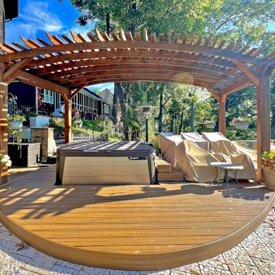 Custom Sebastopol Pergola (Options: 22' L x 12' Arc W, California Redwood, 4-Post Anchor Kit for Concrete, 2 Ceiling Fan Bases, 10.5' H Posts, Viking End Cut for Supports & Rafters, Transparent Premium Sealant). Photo Courtesy of K. Johnson of Gallatin, TN.