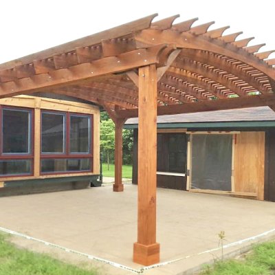 Sebastopol Pergolas (Options: 21' L x 19' Arc W, Mature Redwood, 4-Post Anchor Kit for High-Wind, with a Ceiling Fan Base, Transparent Premium Sealant). Photo Courtesy of R. Erickson of Sawyer, Michigan.