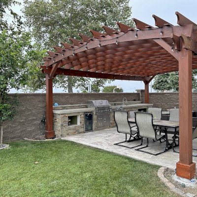 Custom Sebastopol Pergola (Options: 28' L x 18' Arc W, California Redwood, 5-Post Anchor Kit for High-Wind, No Ceiling Fan Base, with Transparent Premium Sealant). Photo Taken 5 Years After Installation. Photo Courtesy of R. Shue of Carlsbad, CA.