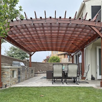 Custom Sebastopol Pergola (Options: 28' L x 18' Arc W, California Redwood, 5-Post Anchor Kit for High-Wind, No Ceiling Fan Base, with Transparent Premium Sealant). Photo Taken 5 Years After Installation. Photo Courtesy of R. Shue of Carlsbad, CA.