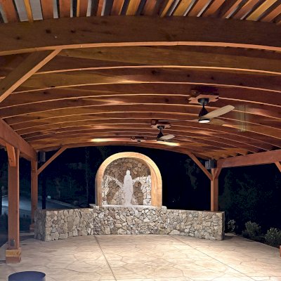 Sebastopol Pergola (Options: 30' L x 24' Arc W, California Redwood, 4 Electrical Wiring Trims, Post Anchor Kit for Concrete, 2 Ceiling Fan Bases, 9' Post Height, Transparent Premium Sealant). Photo Courtesy of the Sycuan Casino of San Diego, CA.