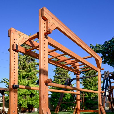Custom Sheldon's Monkey Bars (Options: 8 ft H, 108.5 ft L, Douglas-fir, Standard Step Option, Transparent Premium Sealant) with Balance Beam and Parallel Bars. Extra Supports Added at the Bottom of the Monkey Bar. Balance Beam Can be Removed and Used Independently.