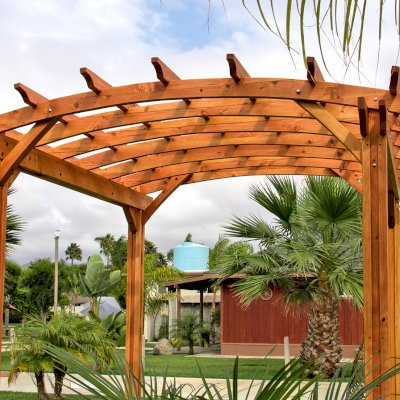 Small Arched Open Sky Pergolas (Options: 10' L x 10' W, No Privacy Panels, Douglas-Fir, No Rain Guard, 9 ft Post Height, No Electrical Wiring Trim, Vertical Decorative Trim, 4-Post Anchor Kit for Concrete, No Curtain Rods, No Retractable Shade Canopy, Transparent Premium Sealant).