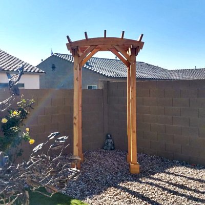 Small Arched Open Sky Pergolas (Options: 5' L x 5' W, No Privacy Panels, Mature Redwood, No Rain Guard, 8.5 ft Post Height, No Electrical Wiring Trim, No Post Decorative Trim, 4-Post Anchor Kit for Concrete, No Curtain Rods, No Retractable Shade Canopy, Transparent Premium Sealant). Photo Courtesy of M. Hall of Peoria, Arizona.