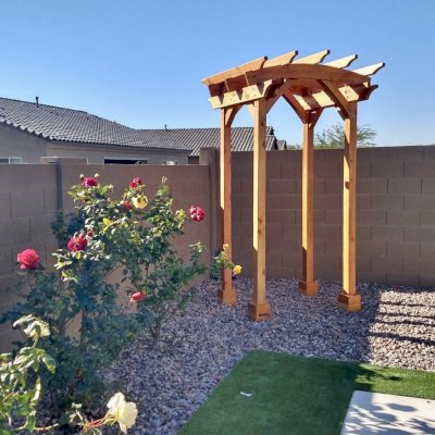 Small Arched Open Sky Pergolas (Options: 5' L x 5' W, No Privacy Panels, Mature Redwood, No Rain Guard, 8.5 ft Post Height, No Electrical Wiring Trim, No Post Decorative Trim, 4-Post Anchor Kit for Concrete, No Curtain Rods, No Retractable Shade Canopy, Transparent Premium Sealant). Photo Courtesy of M. Hall of Peoria, Arizona.
