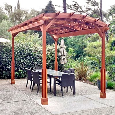 Small Arched Pergola Kits (Options: 14' L x 10' W, No Privacy Panels, California Redwood, No Rain Guard, 9 ft Post Height, No Electrical Wiring Trim, Custom Vertical Decorative Trim, 4-Post Anchor Kit for Concrete, No Curtain Rods, No Retractable Shade Canopy, Transparent Premium Sealant). Photo Courtesy of L. Demello of St. Helena, California.