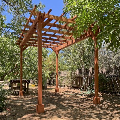 Small Garden Pergola Kit (Options: 12' L x 8' W, No Privacy Panels, California Redwood, 8 ft Post Height, 4-Post Anchor Kit for High-Wind, No Curtain Rods, No Decorative Trims, Transparent Premium Sealant). Photo Courtesy of J. Lumsden of Cloverdale, CA.