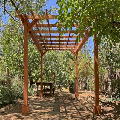 Small Garden Pergola Kit (Options: 12' L x 8' W, No Privacy Panels, California Redwood, 8 ft Post Height, 4-Post Anchor Kit for High-Wind, No Curtain Rods, No Decorative Trims, Transparent Premium Sealant). Photo Courtesy of J. Lumsden of Cloverdale, CA.