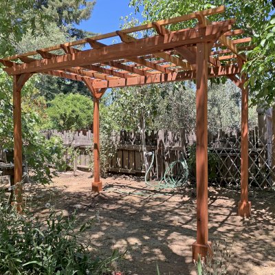 Small Garden Pergola Kit (Options: 12' L x 8' W, No Privacy Panels, California Redwood, 8 ft Post Height, 4-Post Anchor Kit for High-Wind, No Curtain Rods, No Decorative Trims, Transparent Premium Sealant). Photo Courtesy of J. Lumsden of Cloverdale, CA.