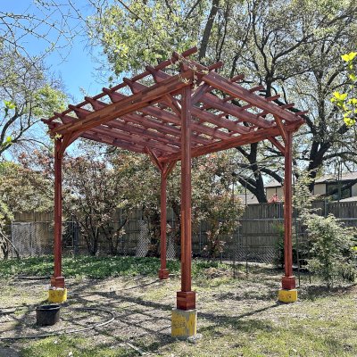 Small Garden Pergola Kit (Options: 12' L x 10' W, No Privacy Panels, Mosaic Redwood, 9.5 ft Post Height, Post Anchor Kit for High-Wind, No Curtain Rods, No Decorative Trims, Cherry Stain Premium Sealant). Photo Courtesy of R. Rao of Dallas, TX.