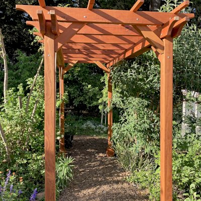 Small Garden Pergola Kit (Options: 12' L x 6' W, 2 x 6's Supports and Rafters by Custom Request, No Privacy Panels, Mature Redwood, 9' Post height, 4-Post Anchor Kit for Concrete, No Curtain Rods, No Decorative Trims, Transparent Premium Sealant). Photo Courtesy of R. Lilley of Guerneville, California.