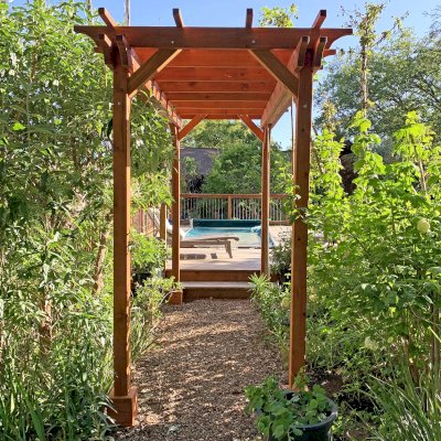 Small Garden Pergola Kit (Options: 12' L x 6' W, 2 x 6's Supports and Rafters by Custom Request, No Privacy Panels, Mature Redwood, 9' Post height, 4-Post Anchor Kit for Concrete, No Curtain Rods, No Decorative Trims, Transparent Premium Sealant). Photo Courtesy of R. Lilley of Guerneville, California.