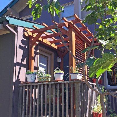 Small Garden Pergola Kit (Options: 8' L x 5' W, with Wall Panel Louver Style, Mature Redwood, No Rain Guard, 8 ft Post Height, No Electrical Wiring Kit, No Post Decorative Trim, No Anchor Kit, No Curtain Rods, 1 Louver Privacy Panel Style Full Height, No Retractable Shade Canopy, Transparent Premium Sealant). Custom End Cuts, Photo Courtesy of J. Siino of Kirkland, WA.