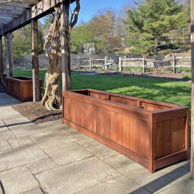 Sonoma Planters (Options: 96" L, 24" W x 24" H, Old-Growth Redwood, No Seating Ledge, 1-inch feet, No Trellis, Interior and Exterior of Box with Sealant (No Growing Vegetables), Transparent Premium Sealant). Photo Courtesy of E. Detrik of Ithaca, New York.