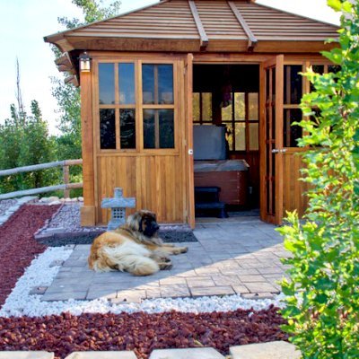 Spa Gazebo Kit (Options: 12' L, 10' W, California Redwood, All Sliding Windows with Screens, 4' x 4' Skylight, 36" H Siding Below Windows, Vertical Siding, French Doors without Screens, No Flooring, Transparent Premium Sealant). Photo Courtesy of B. Whiteaker of Corvallis, Montana.