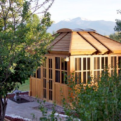 Spa Gazebo Kit (Options: 12' L, 10' W, California Redwood, All Sliding Windows with Screens, 4' x 4' Skylight, 36" H Siding Below Windows, Vertical Siding, French Doors without Screens, No Flooring, Transparent Premium Sealant). Photo Courtesy of B. Whiteaker of Corvallis, Montana.