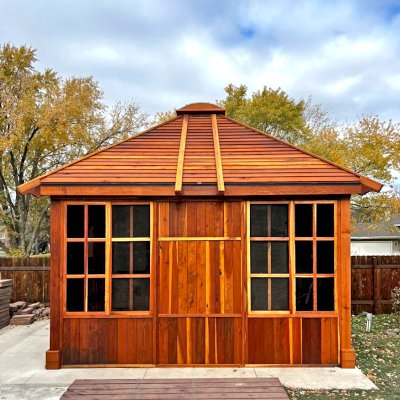 Custom Spa Gazebo Kit (Options: 12' L, 12' W, California Redwood, Combination of Fixed and Sliding Windows, 2' x 4' Skylight, 30" H Siding Below Windows, Vertical Siding, Japanese Doors with Screens, Custom Pitch, Shiplap Roof, No Flooring, Transparent Premium Sealant). Photo Courtesy of A. Calatayud of Savage, MN.