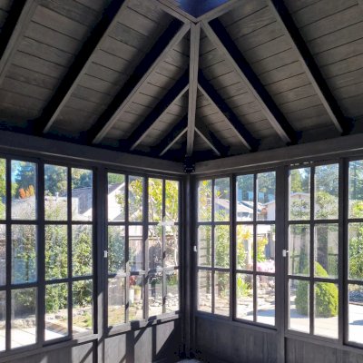 Spa Gazebo Kit (Options: 14' L, 14' W, Douglas-Fir, All Sliding Windows with Screens, 4' x 4' Skylight, 24" H Siding Below Windows, Vertical Siding, French Doors Without Screen, No Flooring, Black Stain Premium Sealant). Photo Courtesy of S. Mortensen of Eureka, CA.