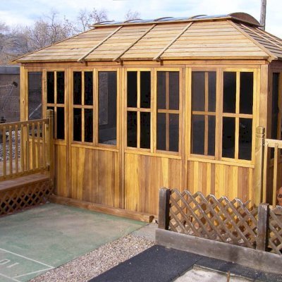 Spa Gazebo Kit (Options: 10' L, 14' W, California Redwood, All Sliding Windows with Screens, 4' x 6' Skylight, 36" H Siding Below Windows, Vertical Siding, Japanese Doors with Screens, No Flooring, Transparent Premium Sealant). Photo Courtesy of Richard S. of Loveland, Colorado.