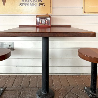 Custom Square Tabletop with Round Stool Seats (Options: 30'' Tabletop, 14'' Diameter Seat Tops, Mature Redwood, Seamless Design, Urethane Finish). Photo Taken 1 Year After Installation. Photo Courtesy of Small Cheval Restaurant, 2815 West Armitage Ave, Chicago, IL 60647.